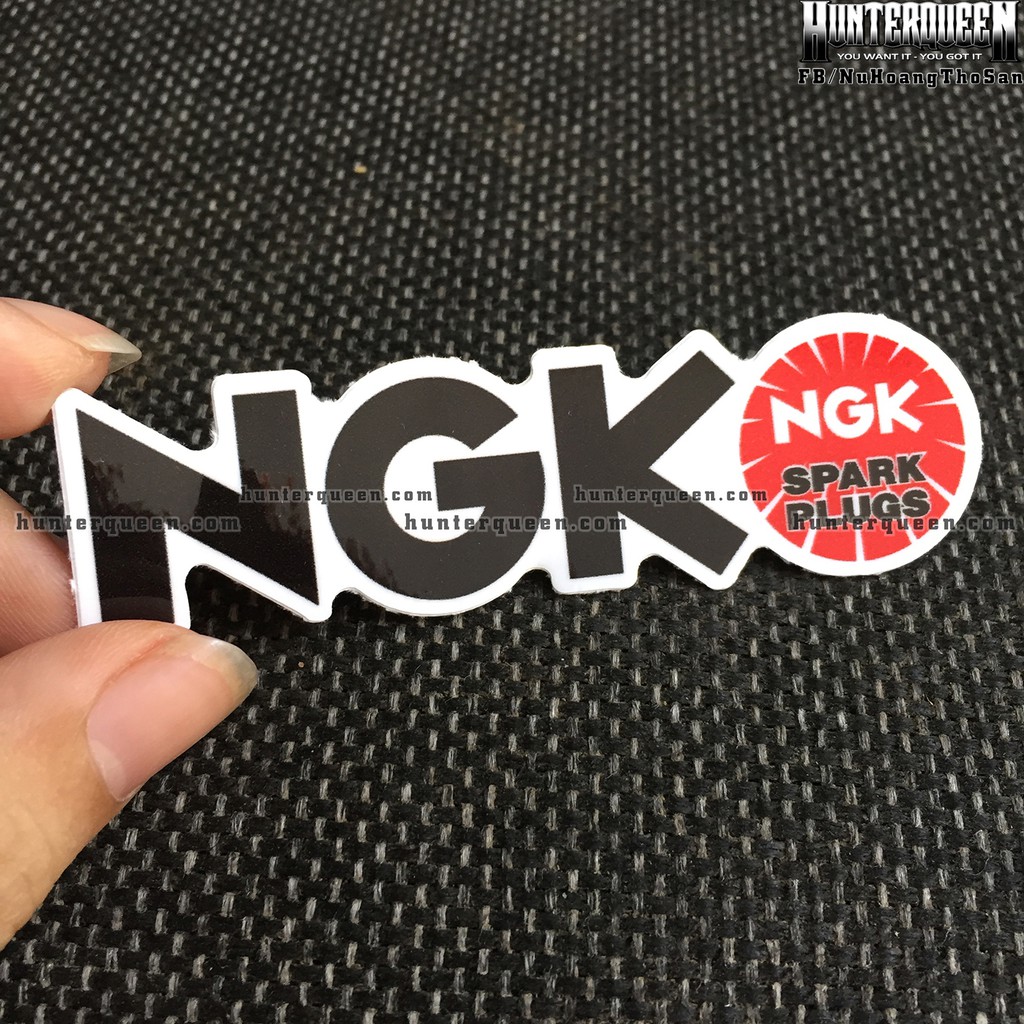 NGK[8.5X2.4cm] decal cao cấp chống nước, sắc nét, bền màu, dính chặt. Hình dán logo trang trí mọi nơi, in theo yêu cầu