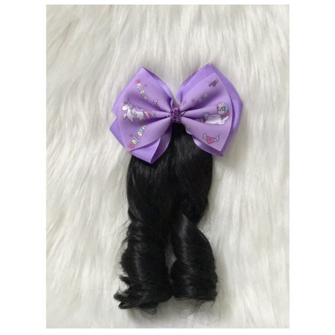 Kẹp nơ tóc xoăn cho bé