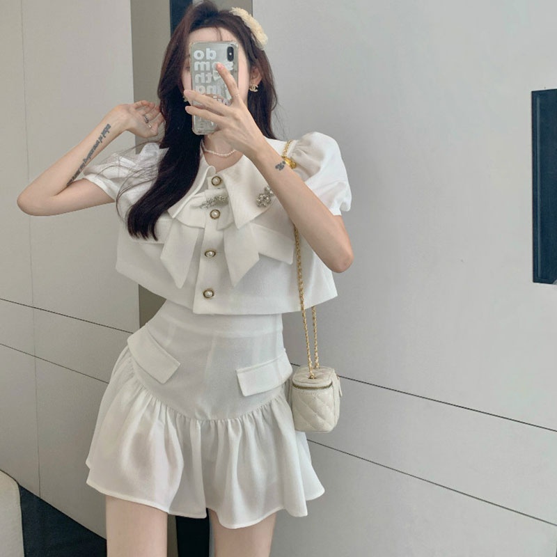 Sét chân váy xòe, áo cổ vest đính nơ tay phồng thiết kế cao cấp thời trang công sở, dự tiệc sang trọng V112 | BigBuy360 - bigbuy360.vn