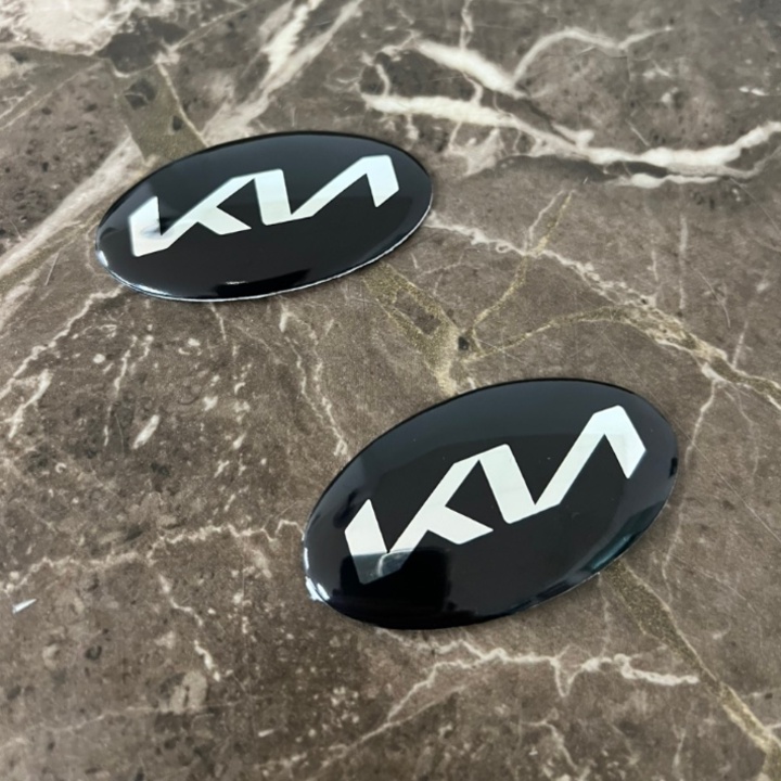 Logo biểu tượng vô lăng xe ô tô KIA, kích thước 60x30mm