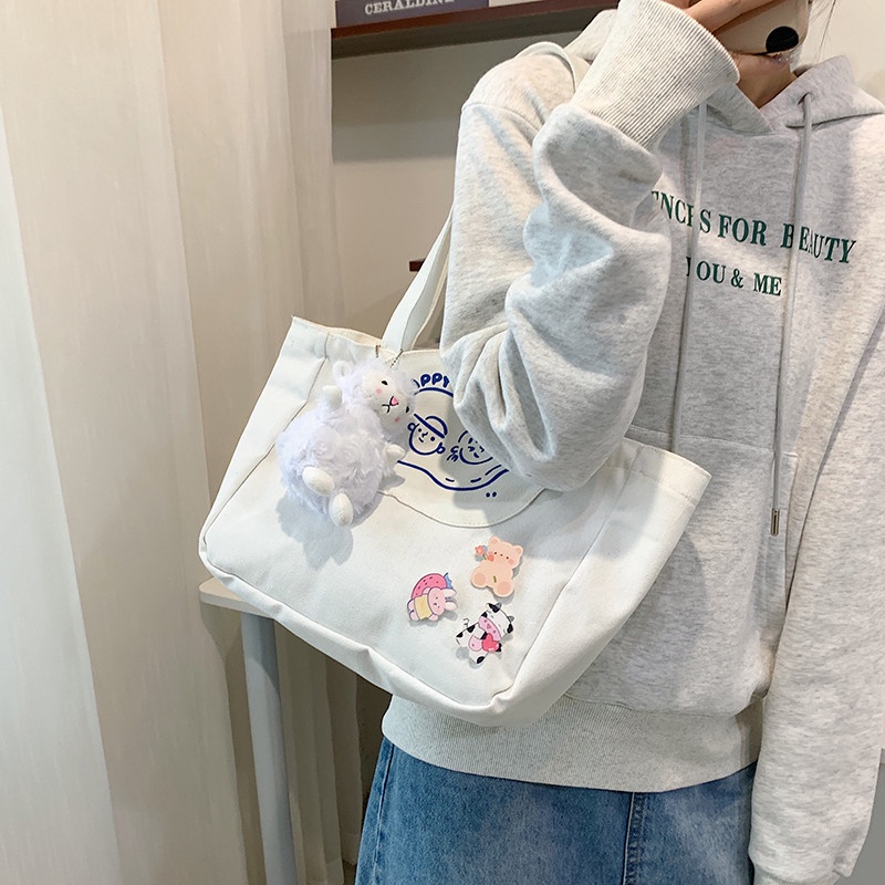 Túi tote đeo vai bằng vải canvas mềm màu trơn in họa tiết phong cách phương Tây mới cho nữ