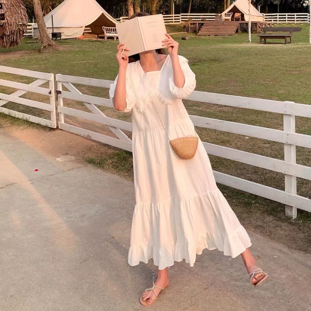 Đầm dáng rộng màu trắng dài hơn đầu gối thời trang cho nữ