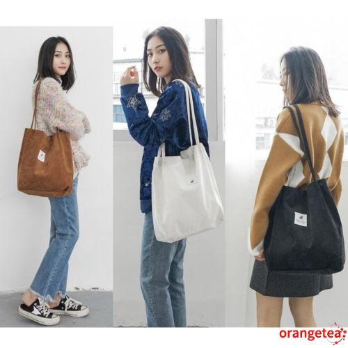 Túi đeo vai làm bằng vải canvas có nút cài nam châm