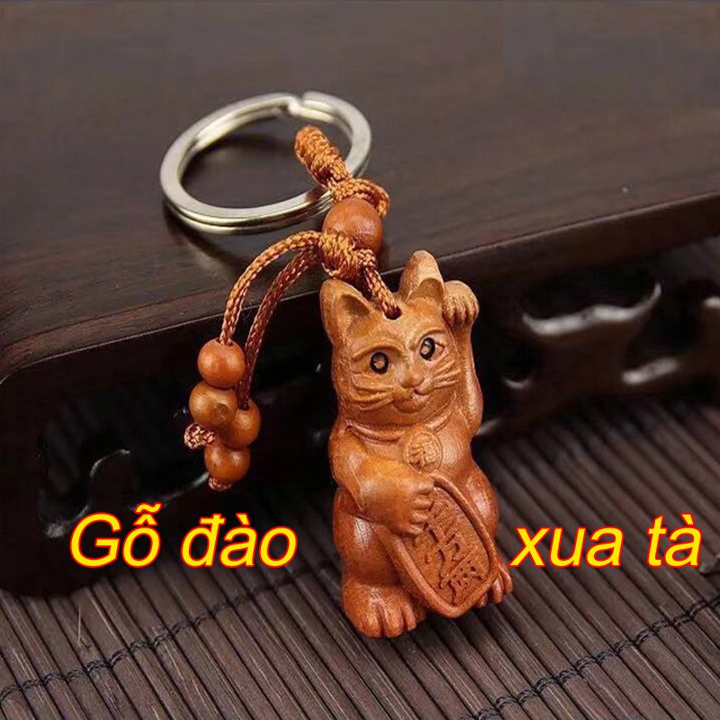 Móc khóa Mèo chiêu tài gỗ đào đuổi tà khí xua tan tai họa
