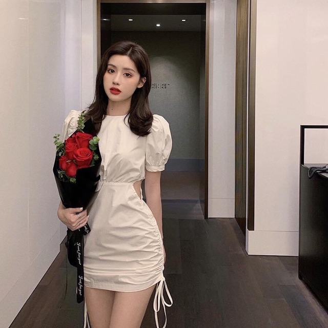 Đầm trắng khoét eo rút thân