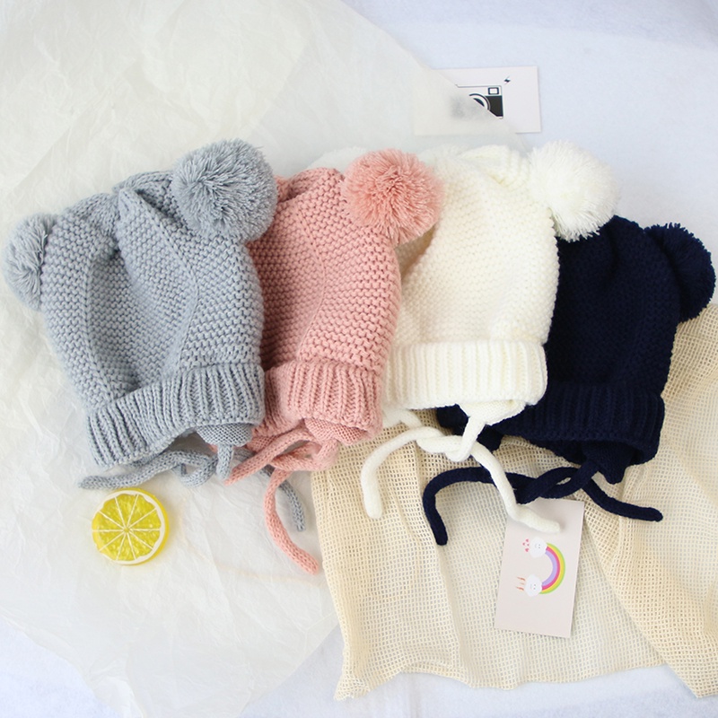 Mũ dệt kim mềm mại thiết kế hình tai thỏ phối quả bóng lông xù ấm áp màu trơn thiết kế dễ thương cho bé
