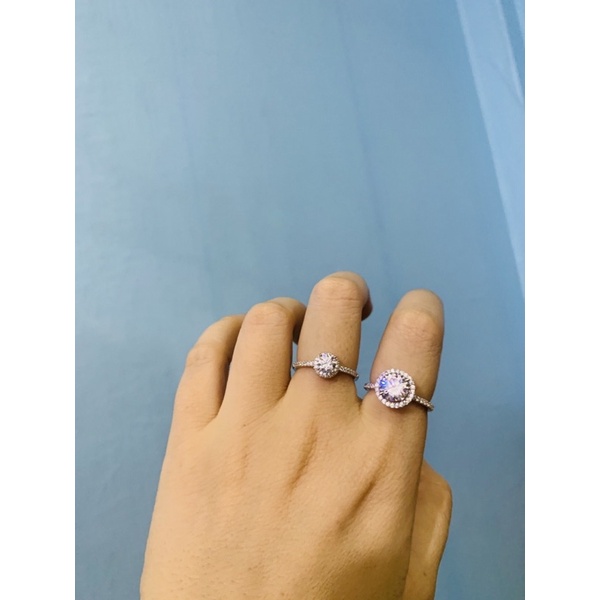 Nhẫn nhỏ 1 hàng đá ôm 1 viên chủ 4-5ly bạc thật phủ vàng trắng