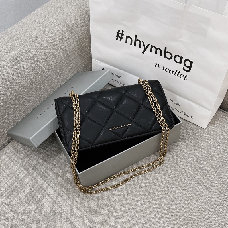 Túi dạng clutch trám ô da lì