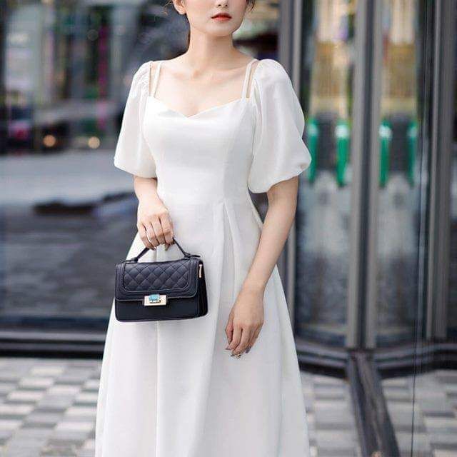 Đầm trắng tay phồng phối đan dây