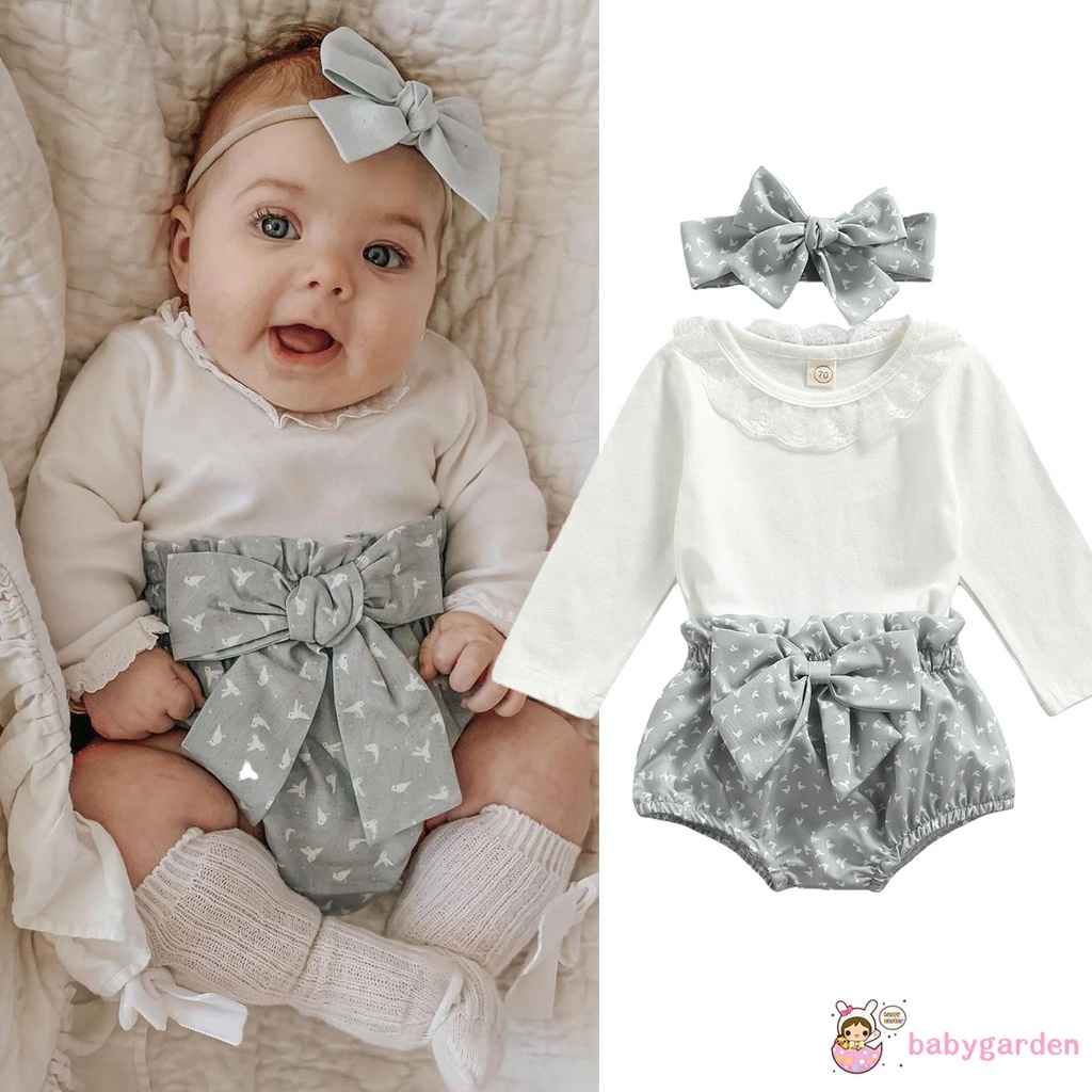 Áo liền thân tay dài cổ tròn màu sắc đơn giản và Quần short in họa tiết và Băng đô nơ cho bé gái