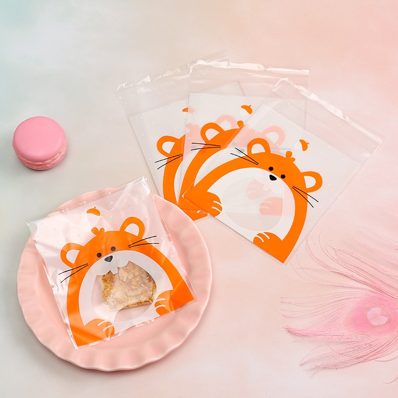 Set 100 túi nhựa đựng bánh kẹo in hình dễ thương