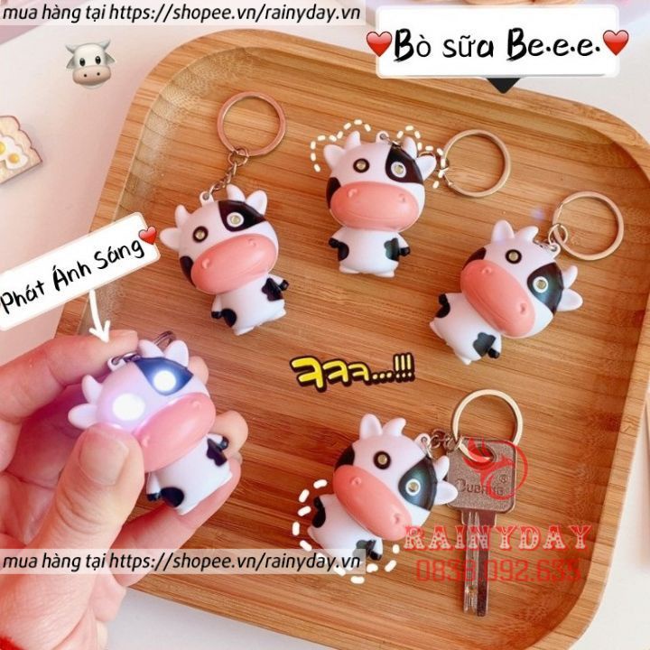 Móc khóa con bò sữa có đèn led phát nhạc treo xe máy balo cặp túi xách cute dễ thương