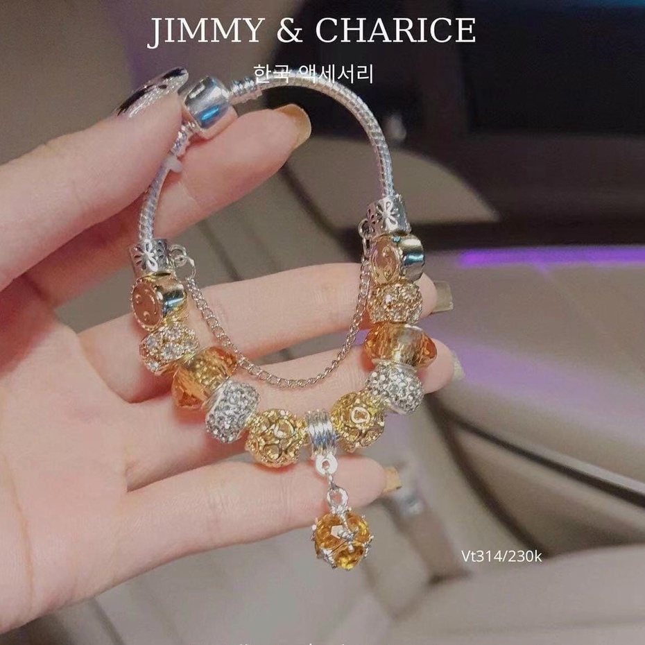 Vòng tay charm Jimmy & Charice  may mắn chất liệu titan mạ bạc không han rỉ bay tiếp xúc nước thoải mái