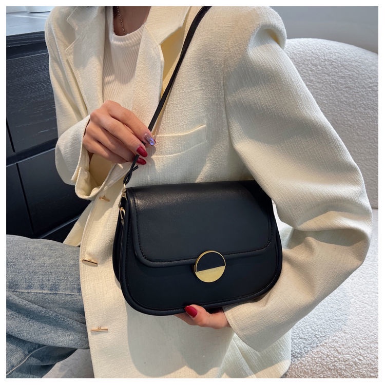 Túi xách nữ đeo chéo khóa tròn kiểu dáng yên ngựa thanh lịch có hai màu trắng và đen