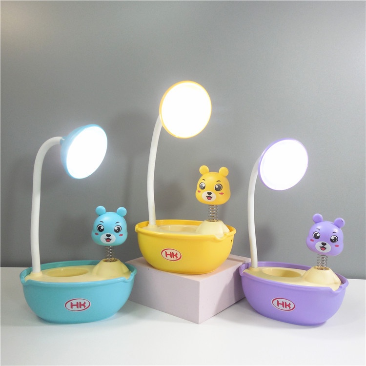 Đèn học chống cận để bàn có pin tích điện đèn led lò xo hình thú có ống cắm bút