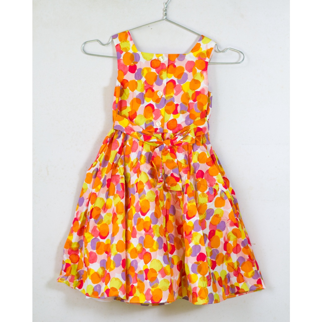 Váy bé gái chấm tròn màu sắc sặc sỡ cam vàng đỏ 5-6 tuổi