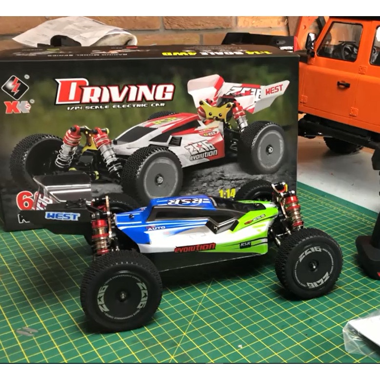 Xe Ô tô Wltoys 144001 tỷ lệ 1/14 Siêu tốc độ 60km/h Chuẩn Thi Đấu 4wd Giảm sóc Kim Loại Phuộc Nhôm Quái Xế XK 144001