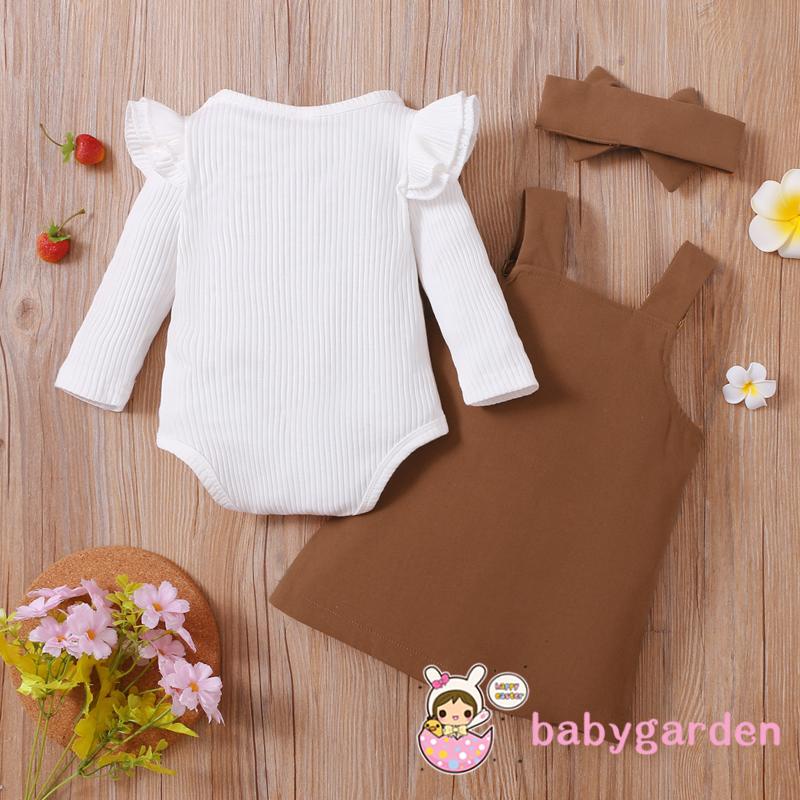 Bộ áo cổ tròn tay dài kiểu nhún bèo có nút gài phía dưới + váy yếm có túi phía trước + băng đô dành cho bé gái