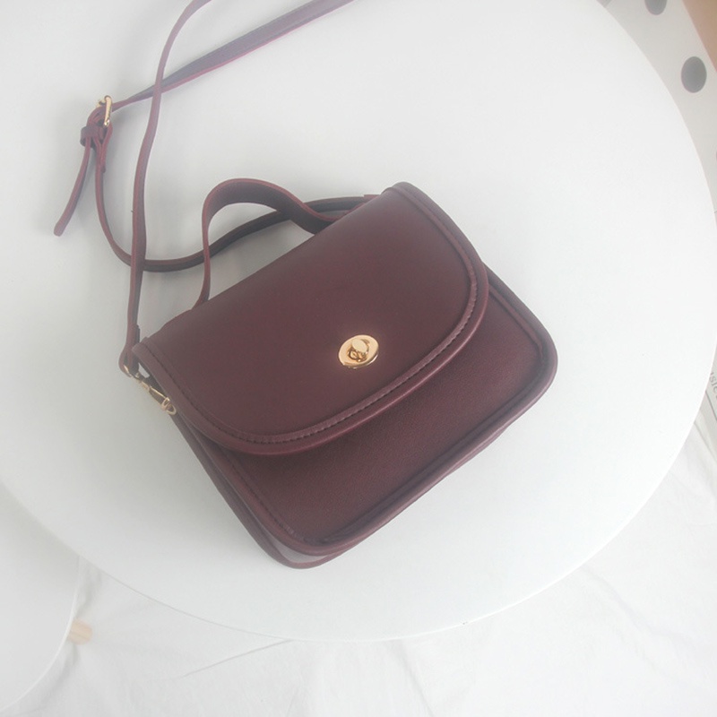 Túi đeo chéo da PU màu trơn có khóa phong cách Hàn Quốc cho nữ