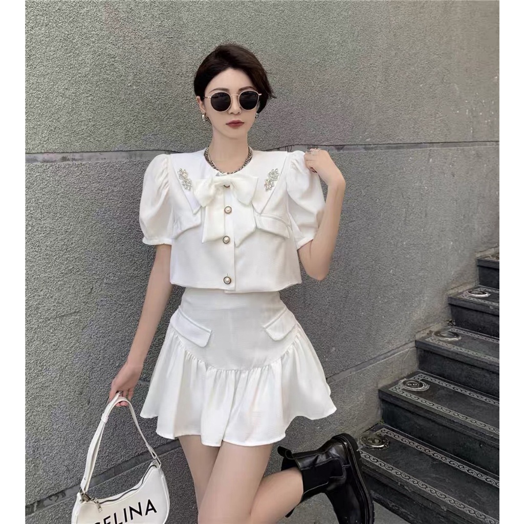 Sét chân váy xòe, áo cổ vest đính nơ tay phồng thiết kế cao cấp thời trang công sở, dự tiệc sang trọng V112 | BigBuy360 - bigbuy360.vn