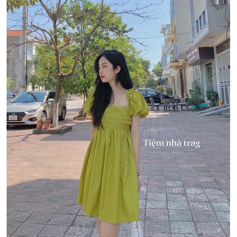 Váy xanh chuối,nơ  buộc lưng.