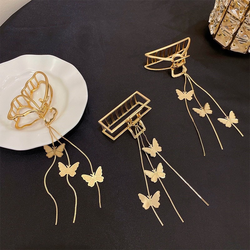 Cặp tóc kim loại hình bướm vàng tua rua