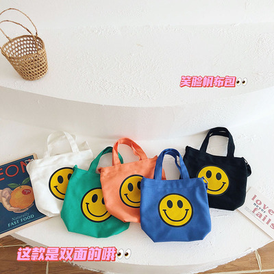Túi đeo chéo in hình mặt cười đáng yêu cho bé