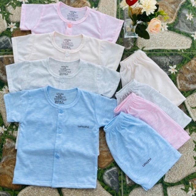 Bộ cotton unchi cúc giữa cho bé