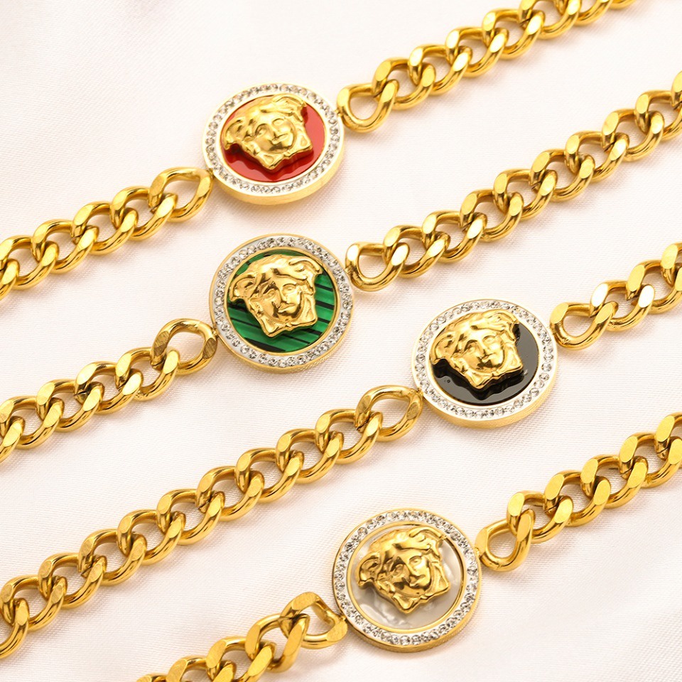 Vòng Tay Versace Bằng Thép Titan In Chữ Rỗng