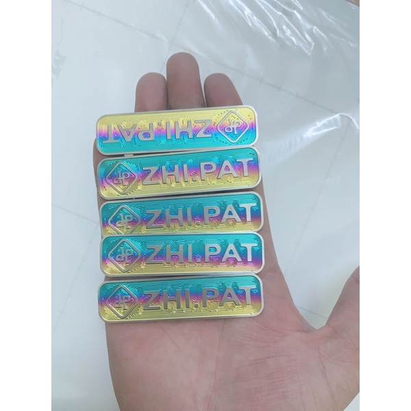 (Giá Đặc Biệt) LôGô Titan ZinPat Có Sẵn Keo 3M Gắn Nhiều Vị Trí Trên Xe