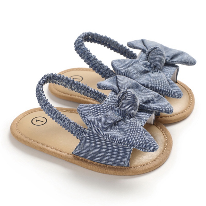 Giày sandal tập đi đính nơ chất liệu vải chống trượt xinh xắn thời trang mùa hè dành cho bé gái sơ sinh