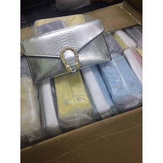Ví clutch đầu rồng