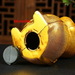 ống heo - hình con trâu vàng