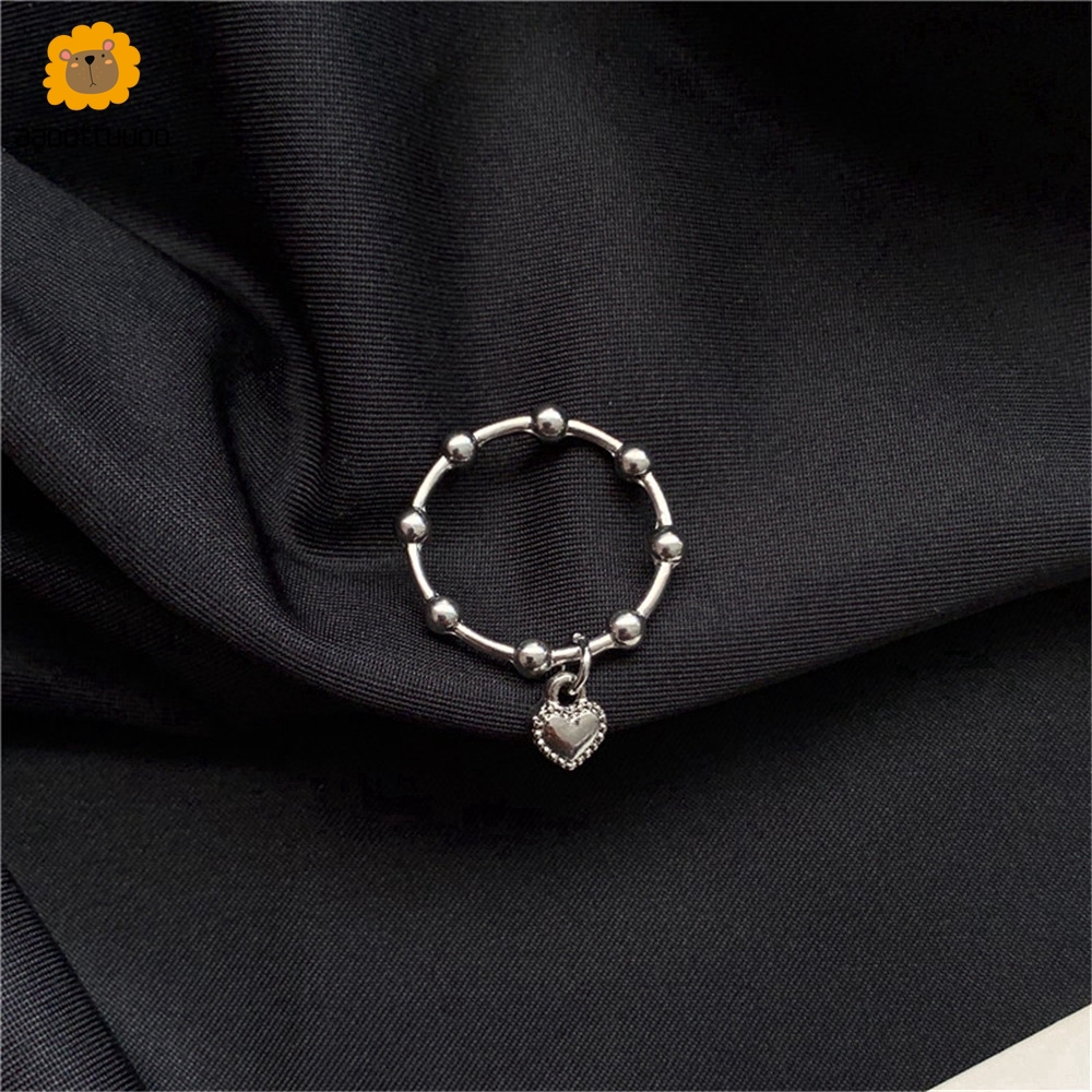 Nhẫn đeo có phụ kiện treo hình trái tim nhỏ xinh