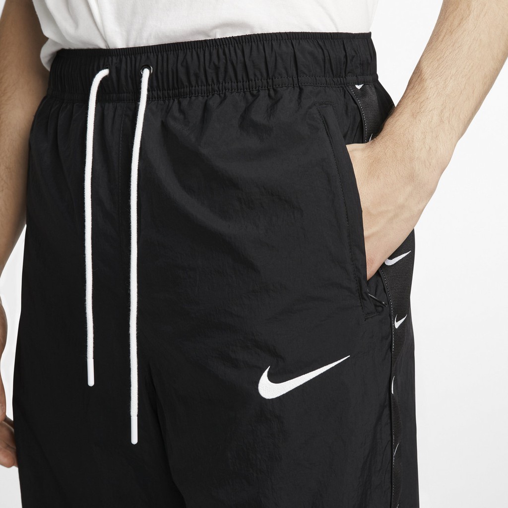 QUẦN DÀI NIKE SWOOSH TAPED SWOOSH POPOVER PANTS - ĐEN /TRẮNG