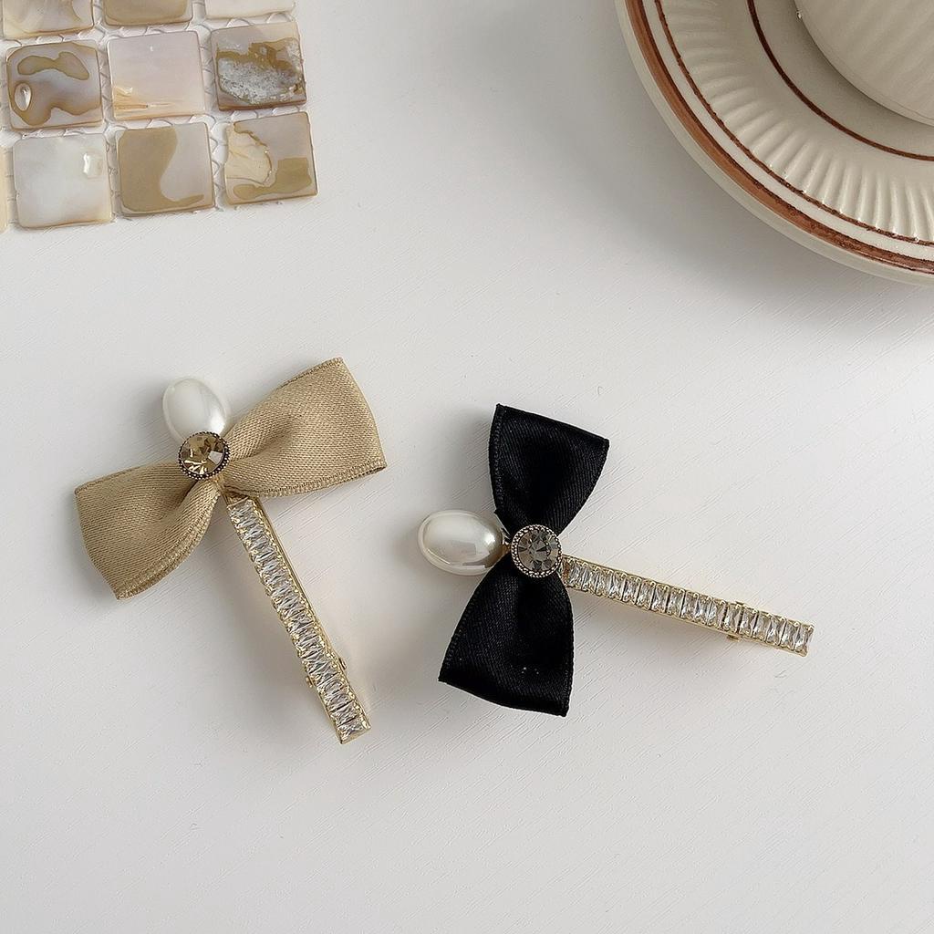 Kẹp tóc nữ hình nơ đính ngọc trai nhân tạo xinh xắn