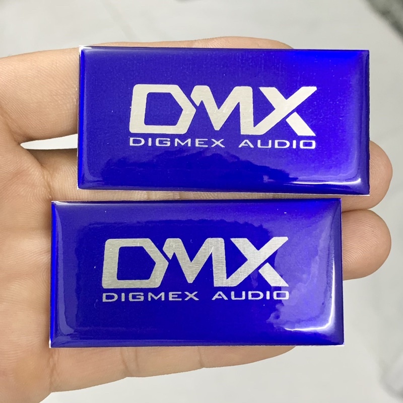 Tem logo DMX, giá 2 cái, kích thước 6cm x 3cm.