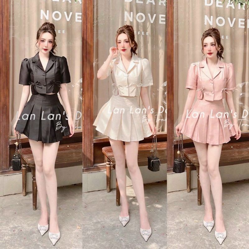 Set áo cổ vest đính nơ + chân váy xếp ly