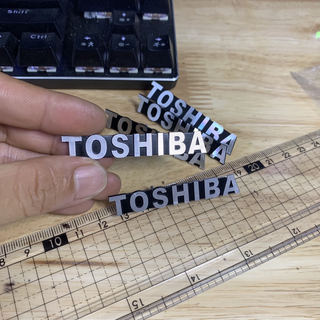 Tem/logo Toshiba nhôm, giá 1 chiếc.