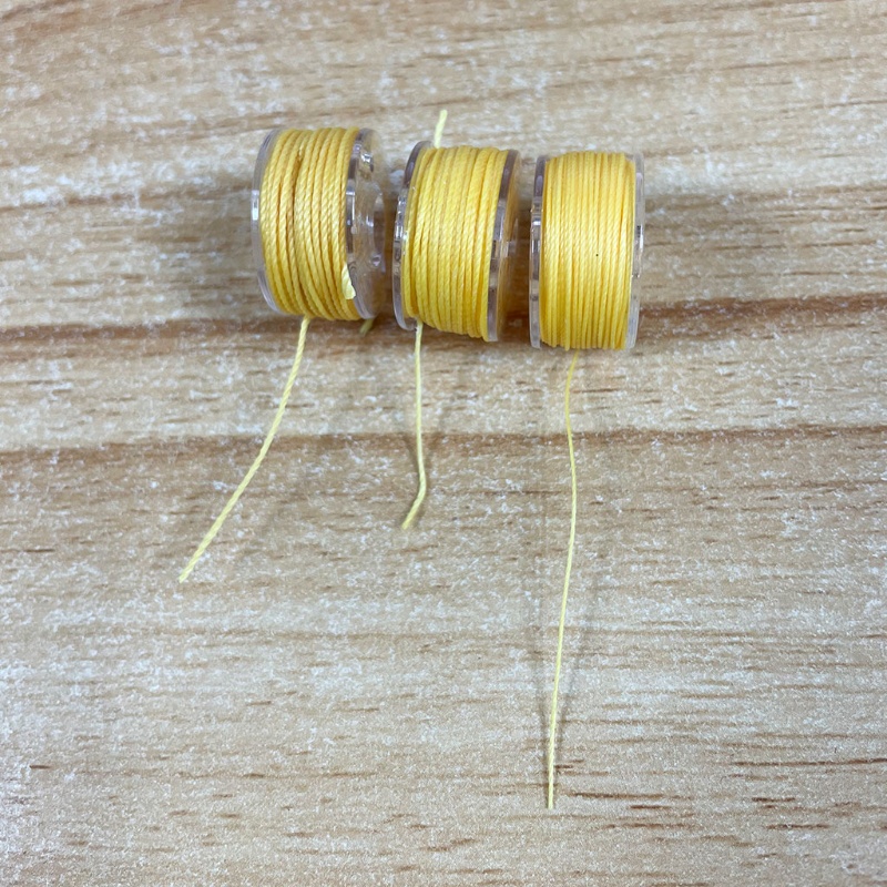 Hộp 25 Suốt Chỉ Trong Suốt Cho Máy Vá