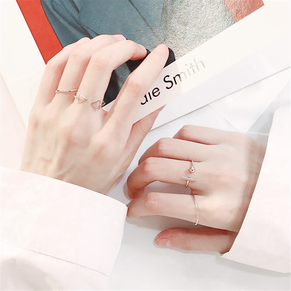 Bộ 4 nhẫn màu bạc bằng kim loại thiết kế kiểu hở phong cách Hàn