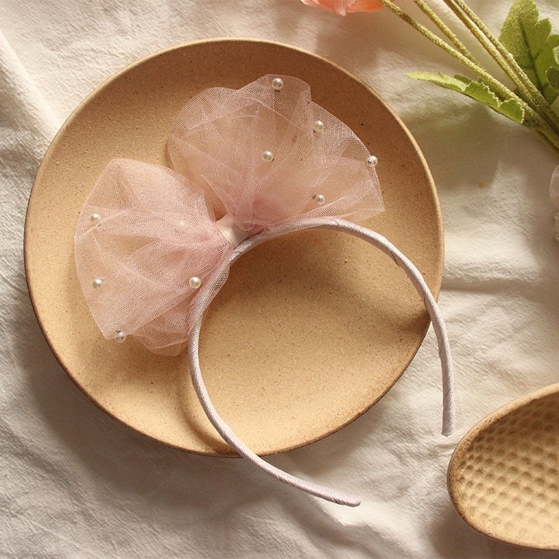 Bờm nơ to đính trai cho bé gái