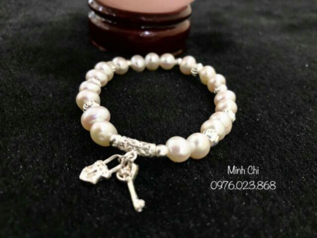 Vòng tay trai nuôi phối charm bạc