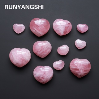 The love shape made of pink quartz is used for home decoration