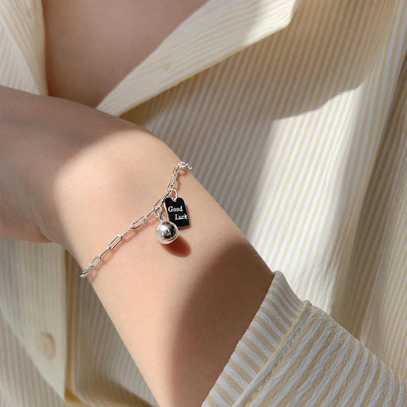 We Flower Vòng đeo tay mạ bạc mặt in chữ Good Luck đính chuông nhỏ xinh xắn cho nữ