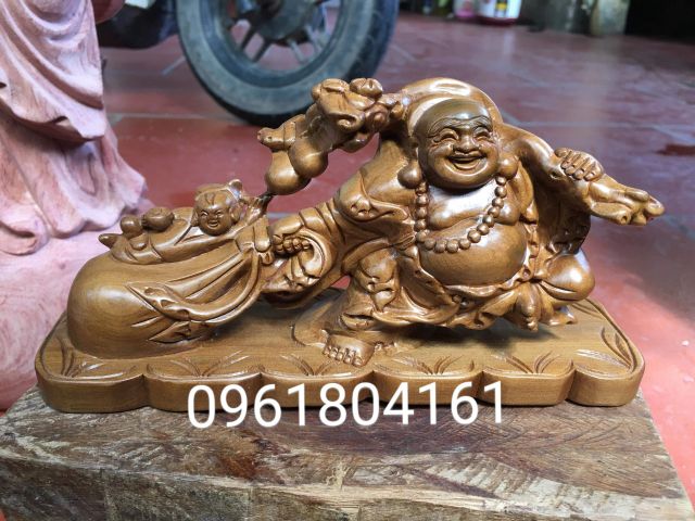 Di lặc kéo bao - phật di lặc kéo bao tiền - gỗ bách xanh thơm dịu