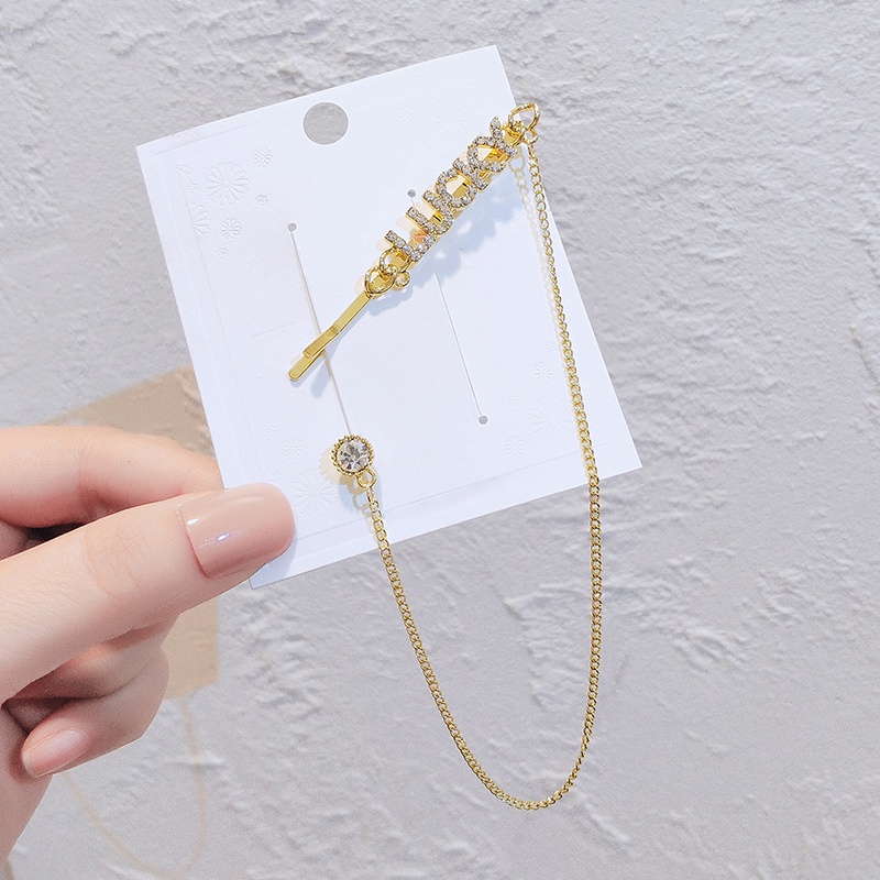 Kẹp tóc JIUDUOLAN thiết kế chữ LUCKY phối chuỗi xích tua rua thời trang độc đáo