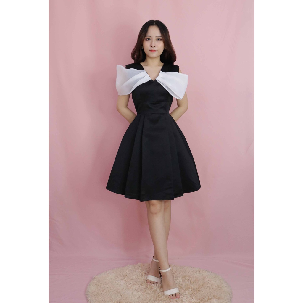Đầm đen dự tiệc dáng xòe xếp ly sang trọng thiết kế cổ v thanh lịch sát nách phối nơ trắng to eo tôn dáng – Lux W