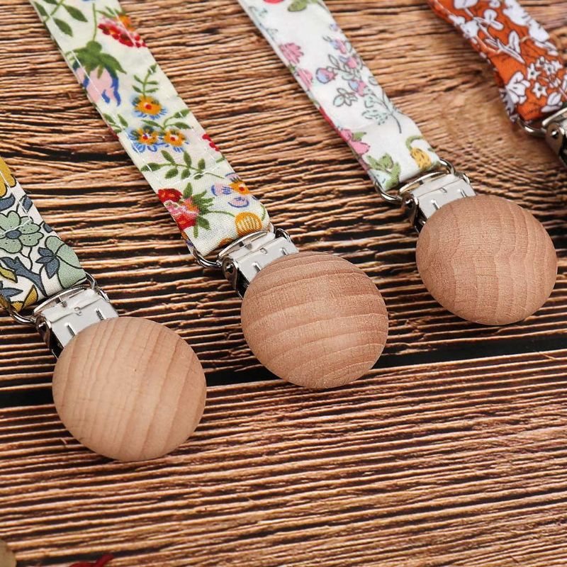 Dây đeo ti giả có kẹp gắn áo em bé tiện dụng
