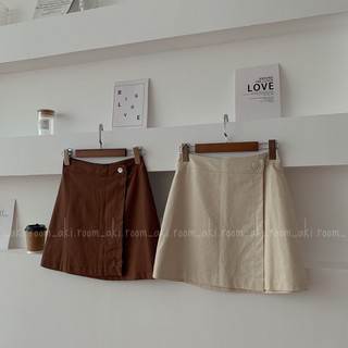 Chân váy ngắn vạt chéo cúc lệch dáng A